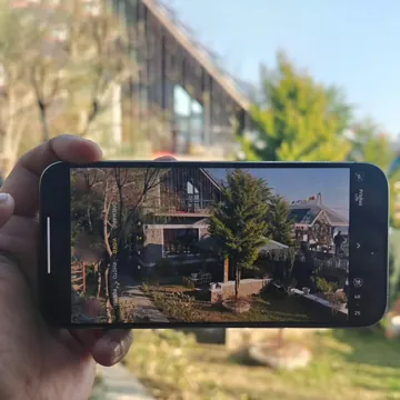 Phone showing a live camera feed of a quiet room